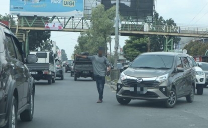 Pak-ogah-di-jalanan-kota-Pekanbaru.jpg